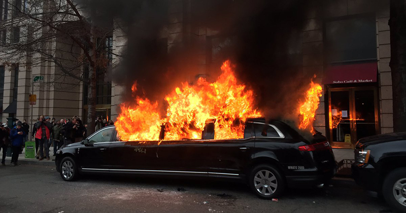 Civil unrest rioters burning limousine in Washington